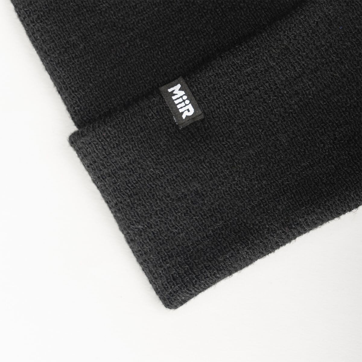 recycled-poly-fine-knit-beanie-l0 WebPDP-RecycledPolyFineKnitBeanie_Studio_TagDetail_Black__BNE005002OS.jpg